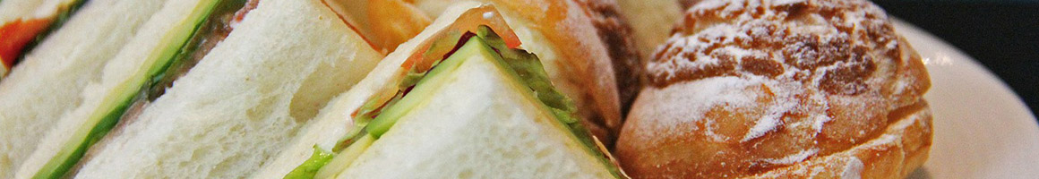 Eating Sandwich Vegetarian at Naked Lunch restaurant in Boulder, CO.